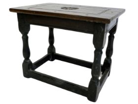 An oak low table, the rectangular top carved with a fleur de lis bearing date 1981, on part turned s