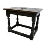 An oak low table, the rectangular top carved with a fleur de lis bearing date 1981, on part turned s