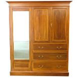 An Edwardian mahogany satinwood cross banded and boxwood strung wardrobe compactum, the moulded