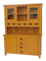A light oak kitchen dresser, with an arrangement of doors, spice drawers, etc., 200cm high, 150cm wi