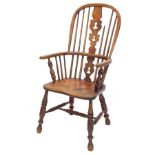 A late 19thC ash and elm Windsor chair with a pierced back splat, solid seat, on turned legs, with H