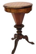 A Victorian walnut trumpet shaped work/games table, the circular top inlaid with a chess board, hing