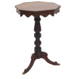 A Victorian mahogany occasional table, the octagonal top with a shaped apron on a turned column and