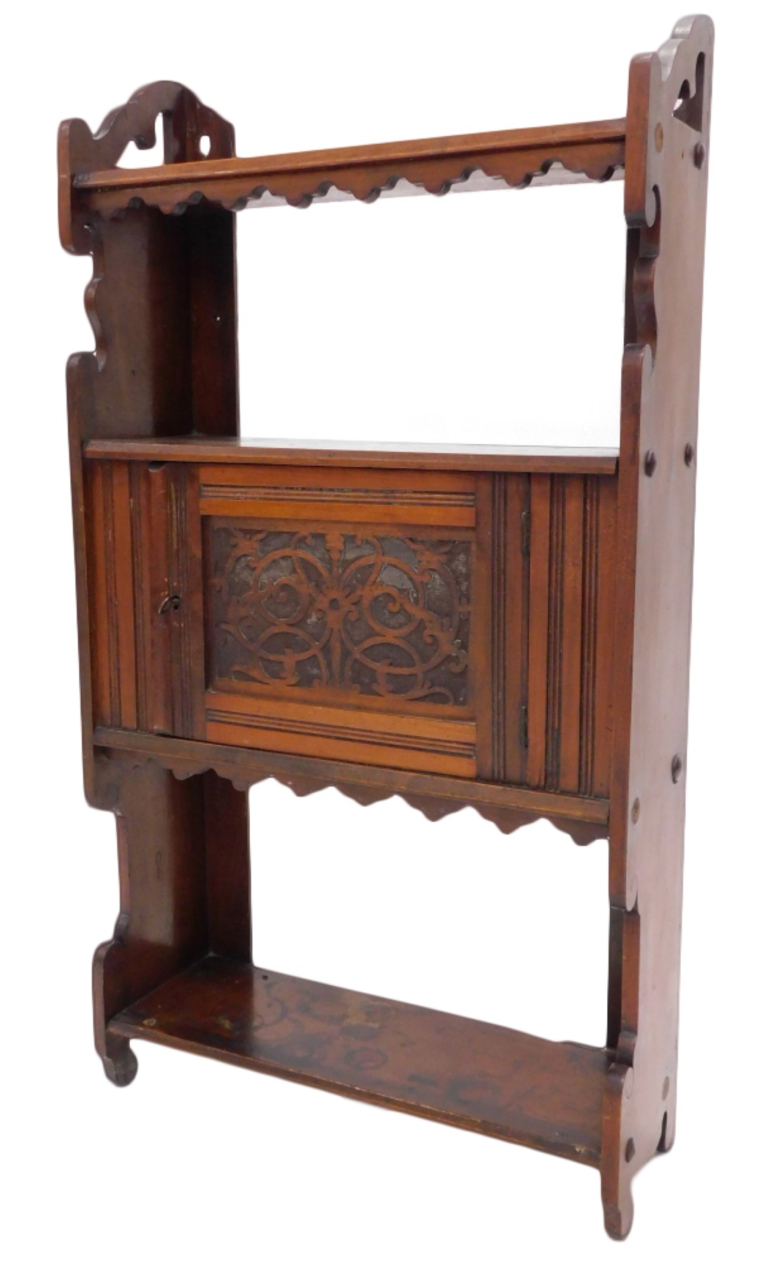 A late 19thC walnut hanging cupboard, with three shelves and a panelled door, on shaped end supports