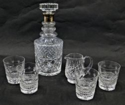 A cut glass decanter, with silver collar and mushroom shaped stopper, 27cm high, four cut glass tumb