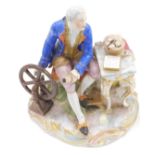 A Vienna porcelain figure group, modelled in the form of a gentleman beside a spinning wheel and a d