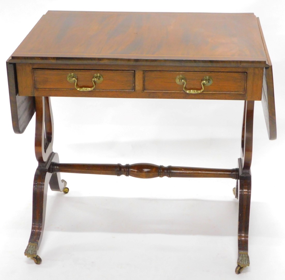 A mahogany and boxwood strung sofa table, in Regency style with two frieze drawers, on lyre shaped e - Image 2 of 3