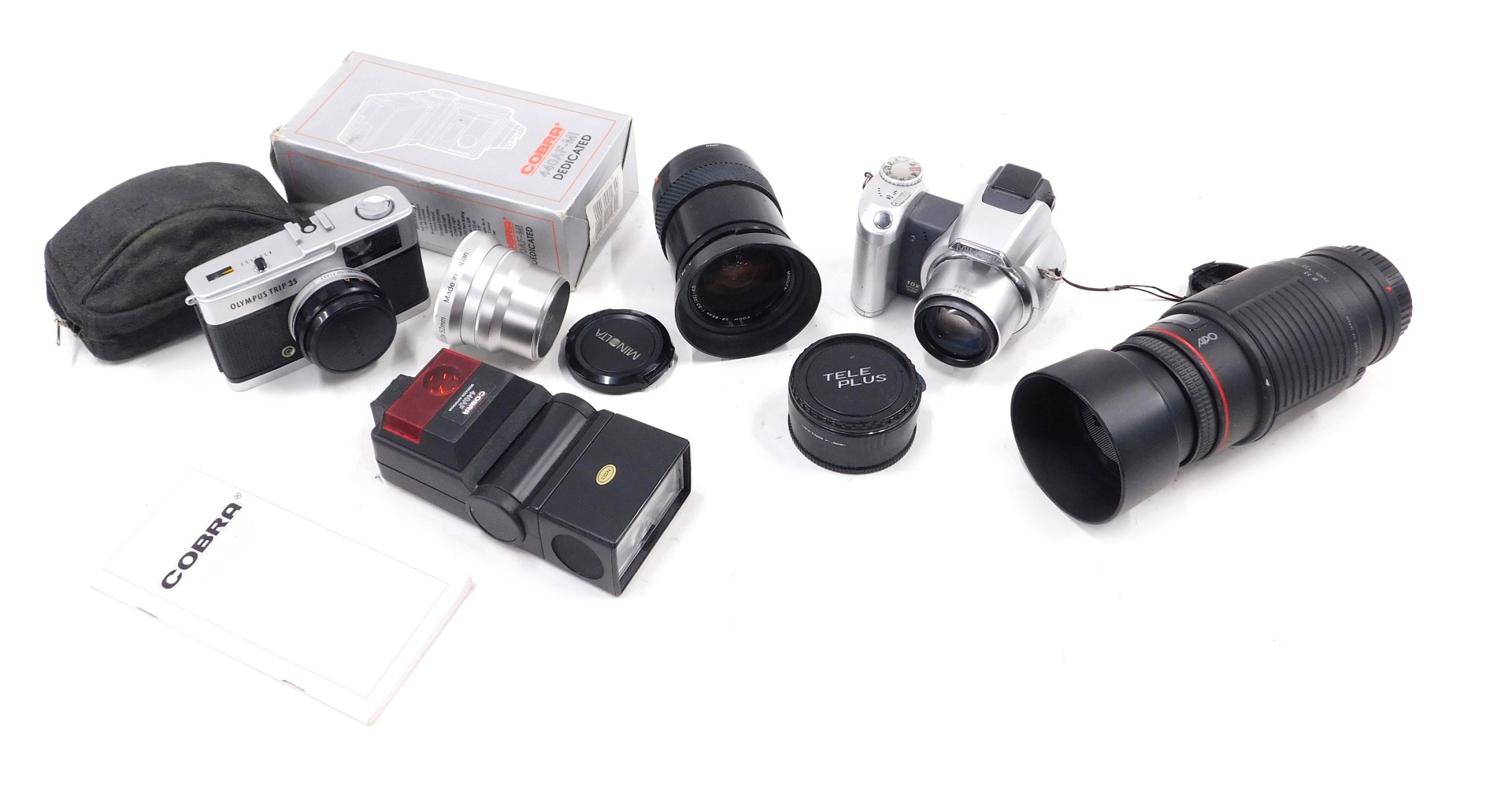 A Minolta auto focus lens, other lenses, cameras, etc.