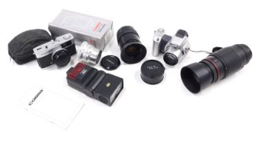 A Minolta auto focus lens, other lenses, cameras, etc.