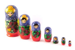A graduated set of hand painted Russian dolls, 22cm high.