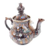 A Bargeware teapot, with typical treacle glazed decoration and presentation plaque Presented by Will