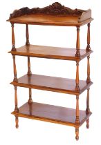 A hardwood four tier whatnot, in Victorian style with a raised carved gallery, on turned supports, 1