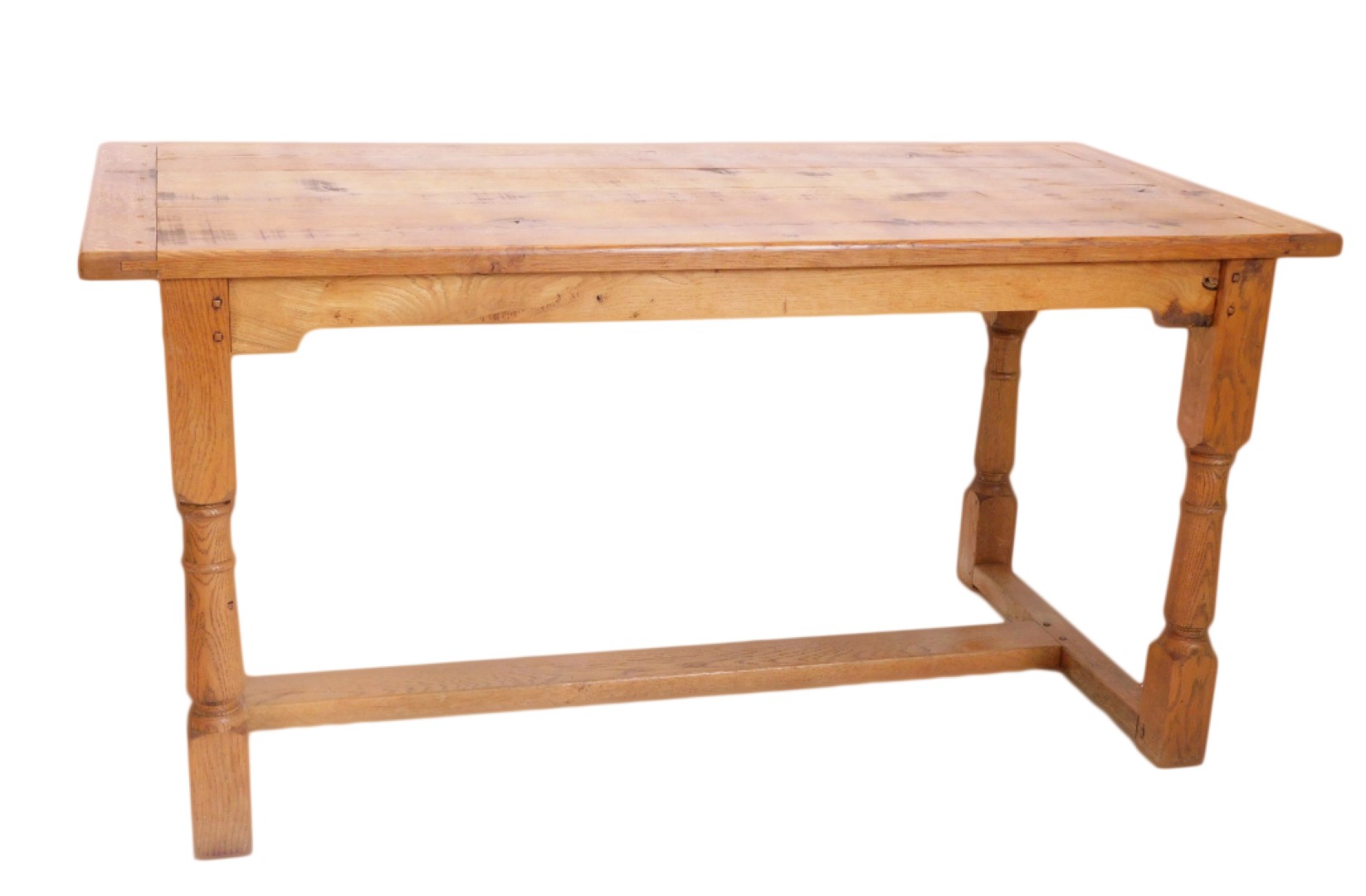 A light oak refectory table, the planked top with cleted ends, on part turned supports with flat H s