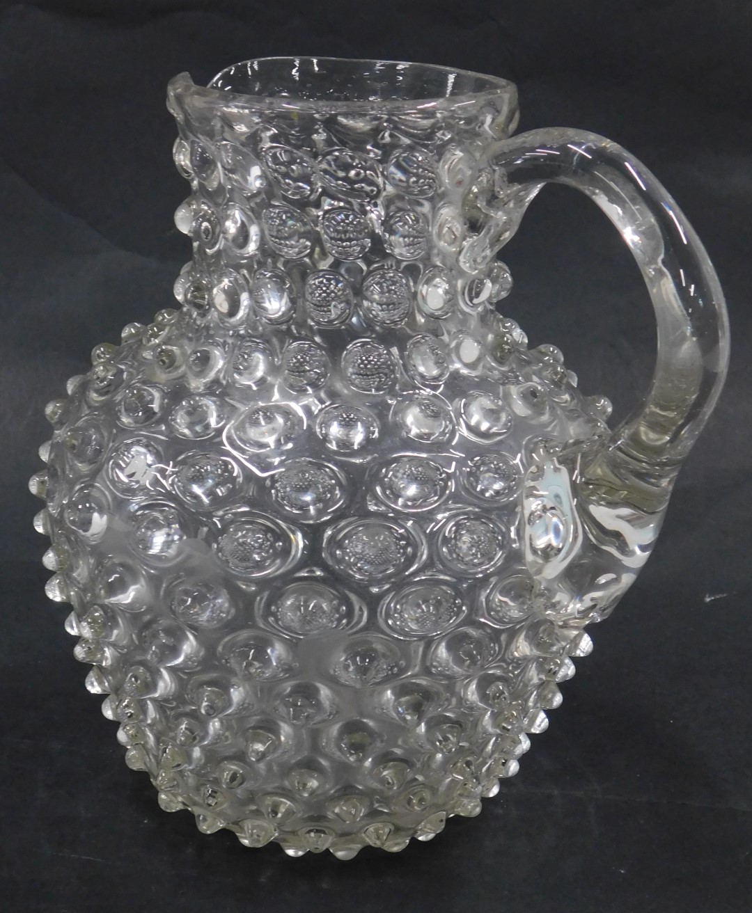 A Victorian glass jug, with raised decoration, 18cm high. - Image 2 of 3