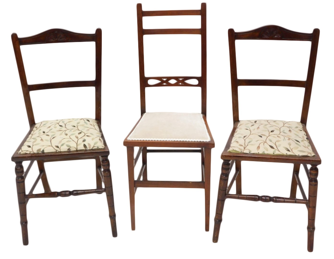 A pair of Edwardian nursing chairs, each upholstered in cream fabric and another chair. (3)