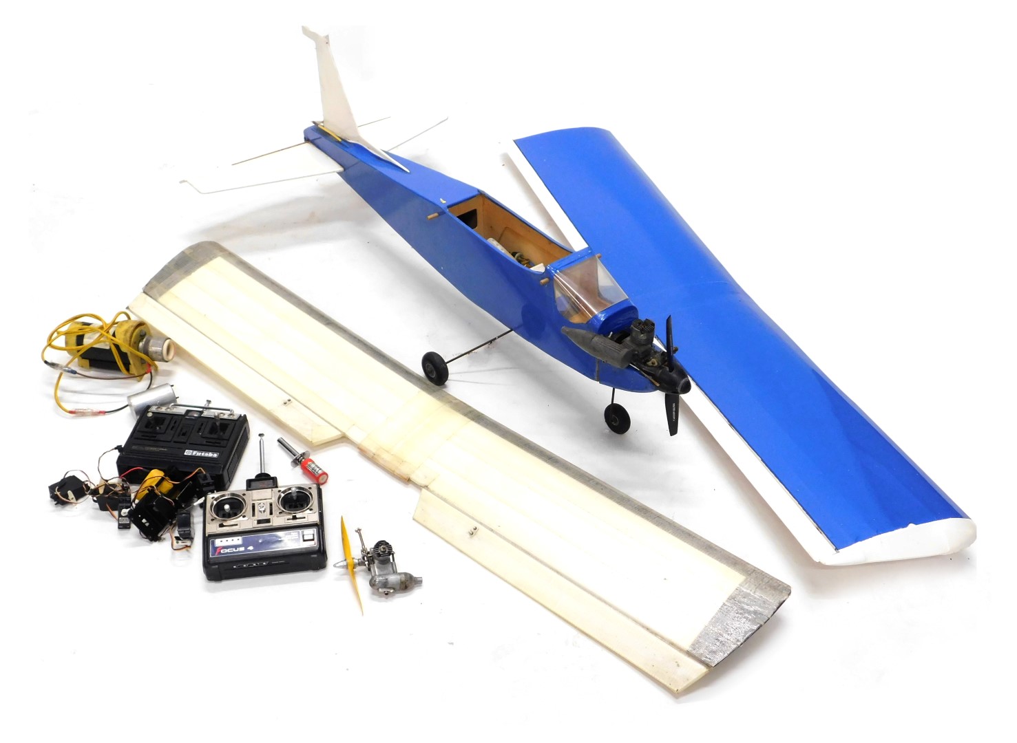 A remote control aeroplane, with various radio controllers, accessories, etc.