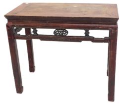 A Chinese red stained altar table, with a pierced frieze, on shaped legs, 75cm high, 90cm wide.