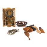 Various silver coloured metal tribal jewellery, tribal combs and a two handled tray.