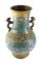 A Chinese champleve enamel two handled vase, decorated with figures, etc., 36cm high.