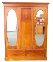 An Edwardian mahogany marquetry and chequer banded double wardrobe, with a moulded cornice above two