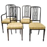 A set of four Edwardian mahogany salon type chairs, each with a lattice shaped back, a padded seat o