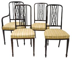 A set of four Edwardian mahogany salon type chairs, each with a lattice shaped back, a padded seat o