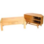 A light oak television stand, with two drawers and a shelf, on tapering legs, 100cm wide, and a ligh