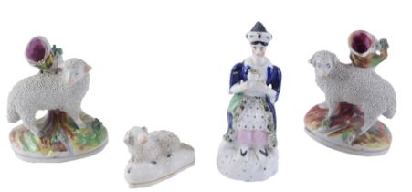 A pair of Staffordshire spill vases, each modelled with a sheep, Staffordshire figure of a turk, and