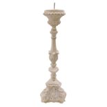 An unglazed terracotta Italian style altar candlestick, 60cm high.