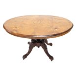 A Victorian walnut and marquetry oval breakfast table, on four turned supports with carved splay leg