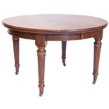 An early 20thC mahogany extending dining table, with rounded ends, moulded edge and a plain frieze,