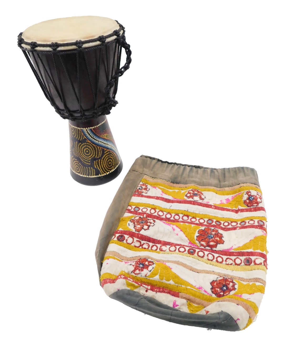 A tribal drum, with raised coloured decoration, 39cm high, and a tribal duffel bag. (2)