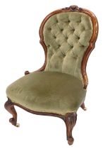 A Victorian show frame nursing chair, with a buttoned back and a padded seat, on cabriole legs with