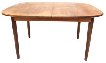 An extending teak dining table, with rectangular top with rounded corners, on turned tapering legs,