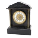 A late 19thC American black slate and metal portico mantel clock, the dial stamped Manufactured by t