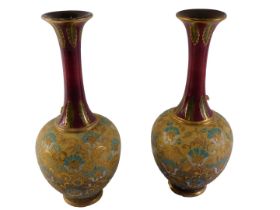 A pair of Royal Doulton Slaters Patent bottle shaped vases, decorated in yellow, blue and red within