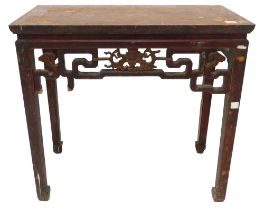 A Chinese red stained altar table, the pierced frieze decorated centrally with a carved stylised bat