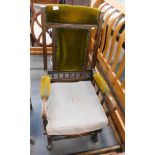 An Edwardian walnut rocking chair, with green velvet lined cushions, on rocker base.