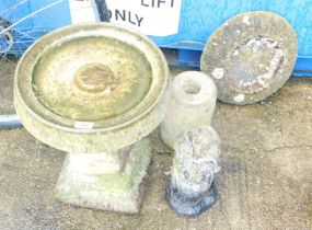 A group of reconstituted stone garden wares, comprising two bird tables, one on shell square base, 5