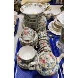 A Booths Floradora pattern part tea service, comprising dinner plates, side plates, bowls, cups, sau