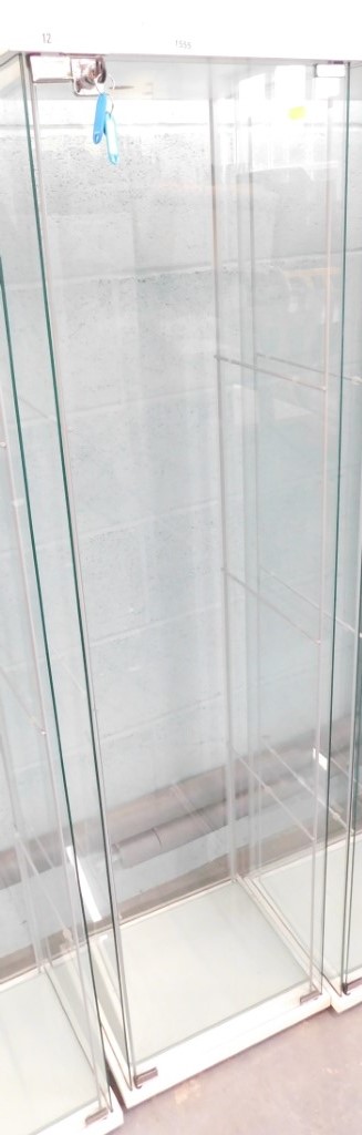 A pillar display cabinet, with fittings for three glass shelves, 164cm high, 41cm wide, and 36cm dee