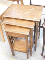 A nest of three oak tables.