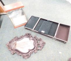 A leatherette travel case, a glass display case, and a blackened wall mirror. (3)