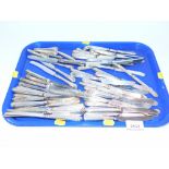 A group of silver handled and stainless steel bladed butter knifes. (1 tray)
