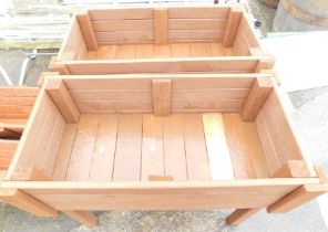 A pair of raised rectangular garden wooden planters, 66cm high, 78cm wide, 42cm deep.