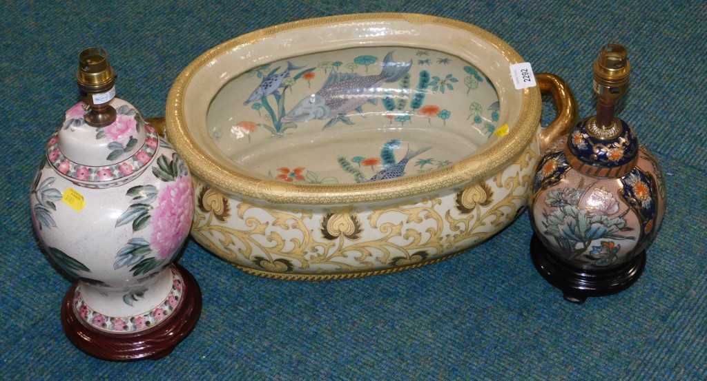 An Oriental style cream foot bath, and two table lamps. (3)