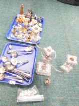 A silver plated three branch candelabra, various spoons, thimbles, Wade Whimsey figures, etc. (2 tra