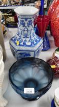 A blue mottled glass bowl, and a blue and white vase.