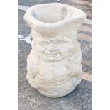 A reconstituted stone Toby jug shaped garden planter or umbrella stand, 43cm high, 28cm wide.
