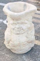 A reconstituted stone Toby jug shaped garden planter or umbrella stand, 43cm high, 28cm wide.